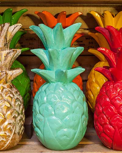 Coloured carved wooden pineapples