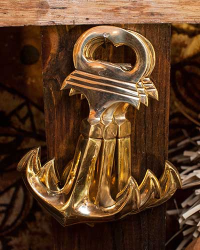 Brass anchor bottle opener and cork screw