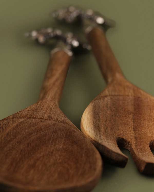 Wooden salad tongs tipped with metal palm trees