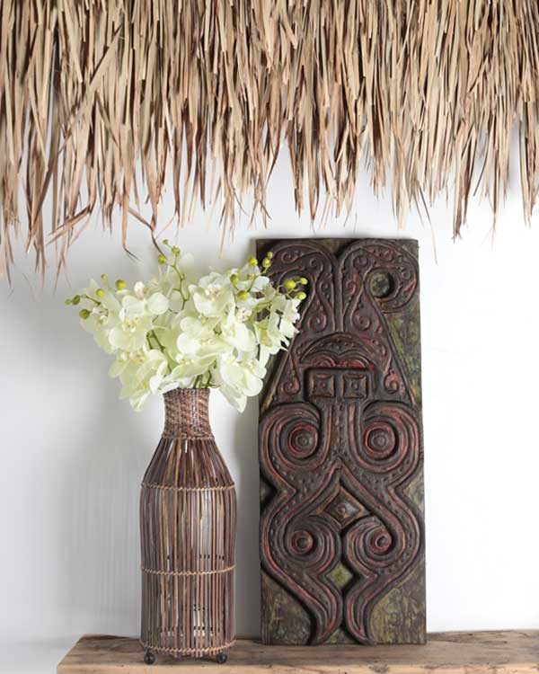 Artificial Orchid Stem with polynesian carving and tropical palm leaf thatch