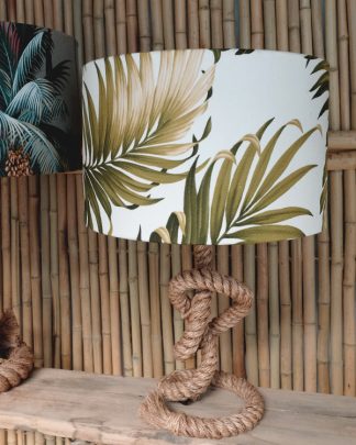 tropical palm print table lampshade drum against bamboo wall