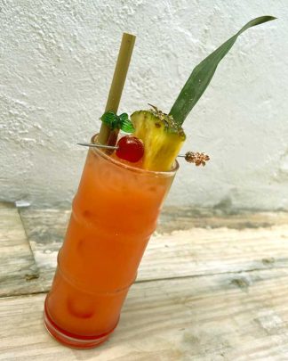 Bamboo Cocktail Glass styled with a cocktail and fruit garnish