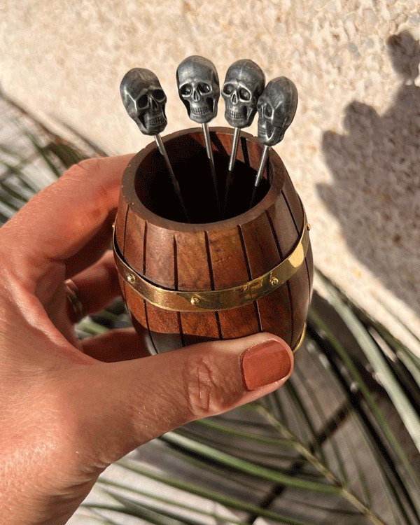 This is an image of Mini Wooden Barrel used to hold Tiki Coocktail Sticks shpaed like skulls for Cocktail Garnishes.