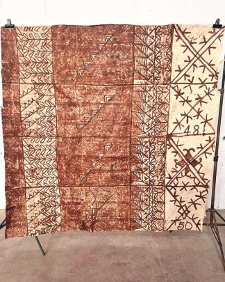 This is a photo of an authentic piece of Tongan Tapa cloth with a cream and brown pattern/ motifs.