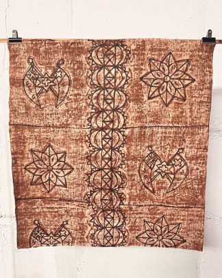 This is a photo of a piece of vintage Tapa cloth from Tonga. You can see the hand pianted deisgn in cream, brown and black colours.