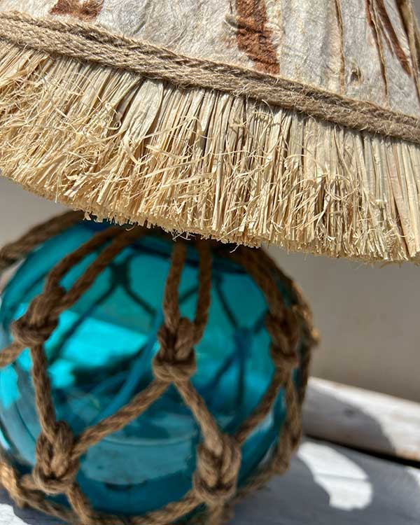 NAUTICAL FISH FLOAT TABLE LAMP WITH TAPA SHADE ANGLE VIEW WEB