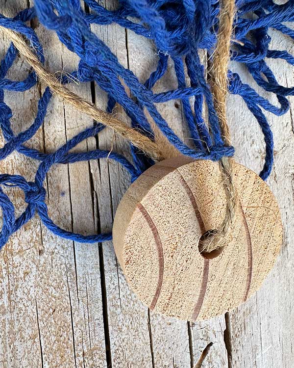 BLUE FISH NET WITH CORK FLOAT DETAIL CLOSE UP