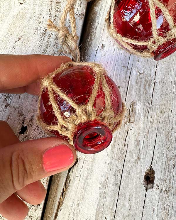 MINI RED FISH FLOAT STRING DECOR HELD IN HAND